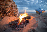 Aulonocara Lwanda Cichlid Lake Malawi Hooded Blanket shown worn on beach with a fire pit